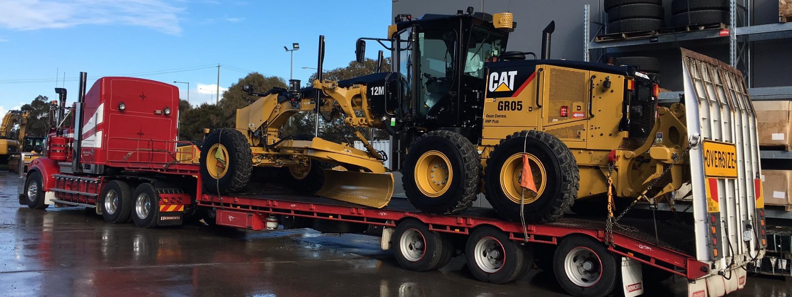 Conquest Semi truck with a small dozer loaded on the trailer