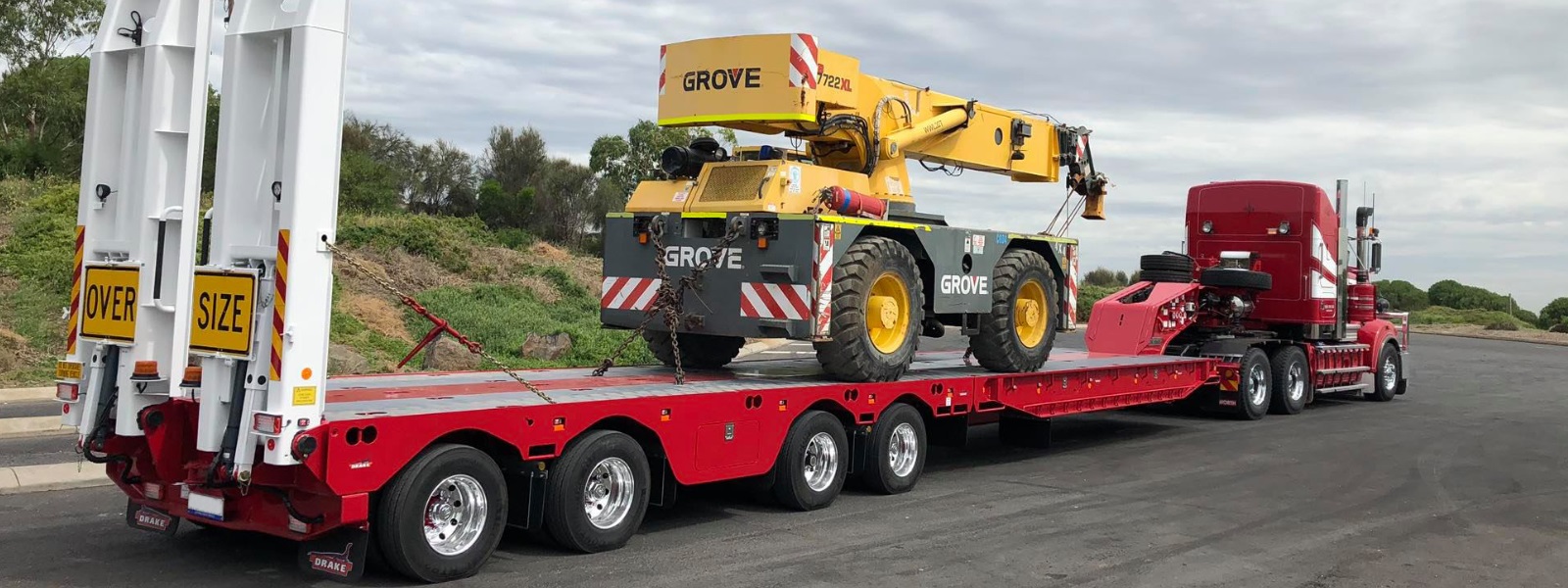 Conquest Semi truck with a small dozer loaded on the trailer