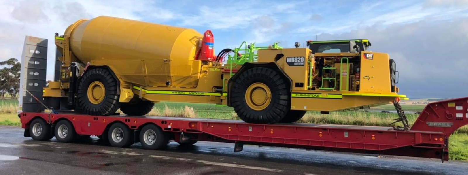 Conquest Semi truck with a small dozer loaded on the trailer