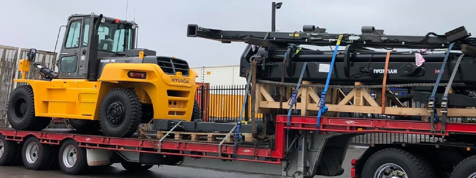 Conquest Semi truck with a small dozer loaded on the trailer